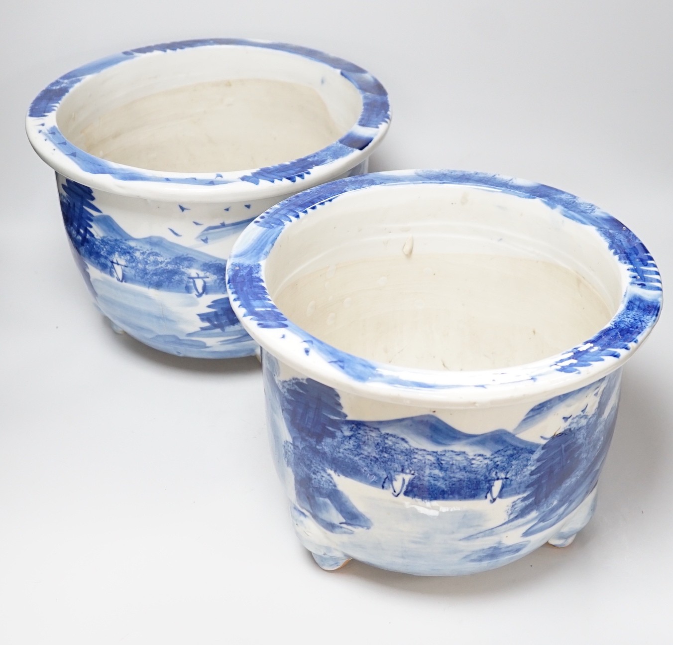 A pair of Japanese blue and white jardinieres, 31cm diameter